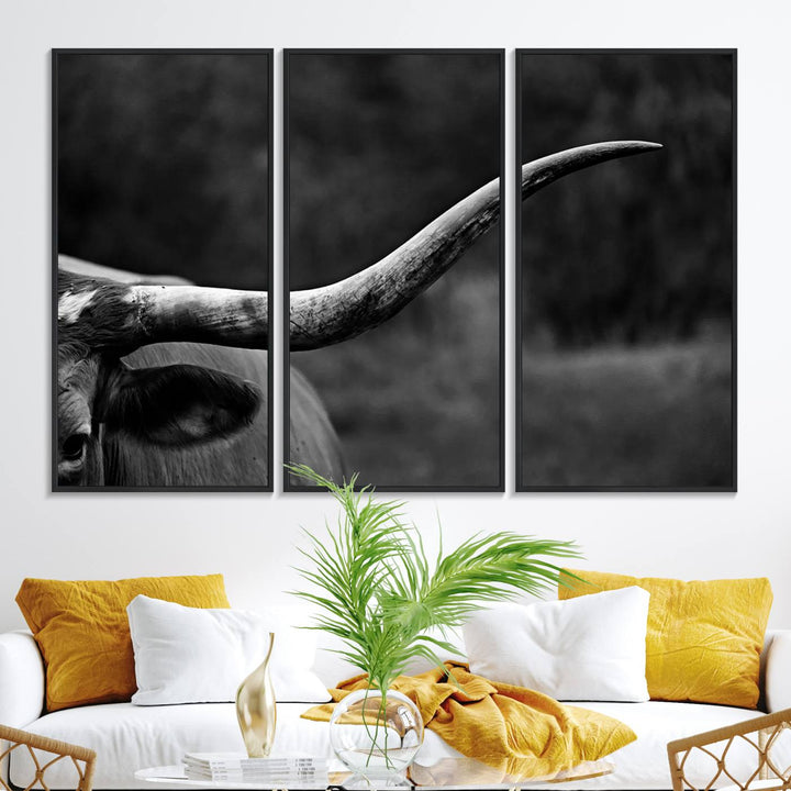 Cow Longhorn Wall Art: This black and white print adds rustic charm.