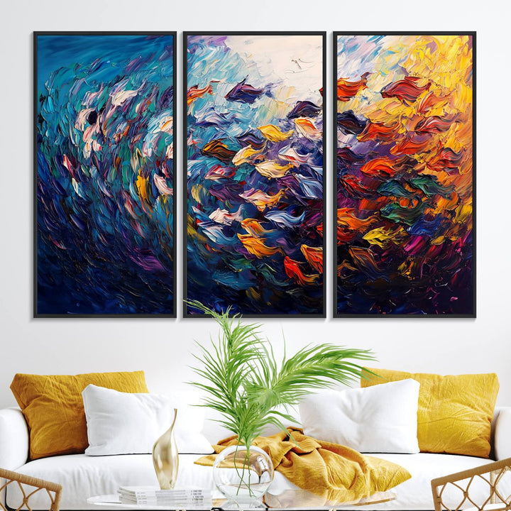 The Vibrant Abstract Fish Swarm Art features a colorful 3-piece canvas that adds a pop of color.