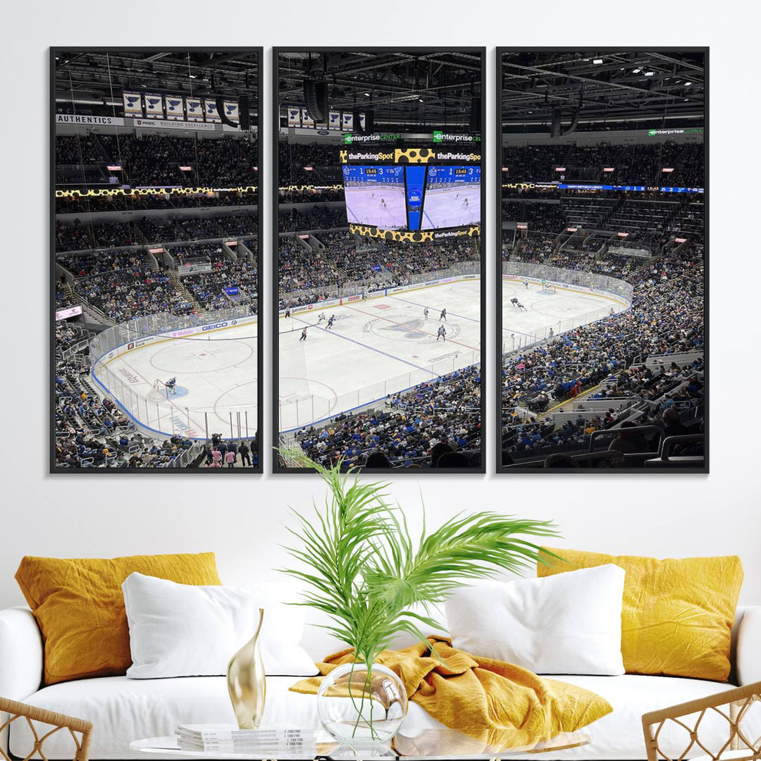 A large Enterprise Center canvas of a crowded hockey arena hangs prominently.