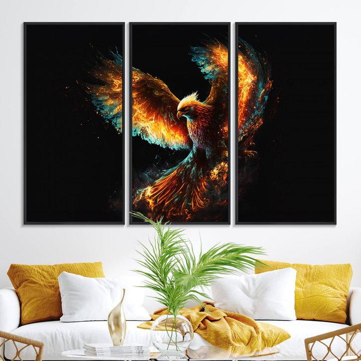 The Fiery Phoenix Canvas Print, showcasing a majestic bird with fiery wings against a black background, makes for the perfect bold decor in your living room.