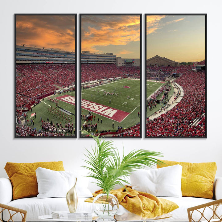 The wall features a Wisconsin Badgers wall art canvas print, capturing the vibrant atmosphere of a full Camp Randall Stadium at sunset.