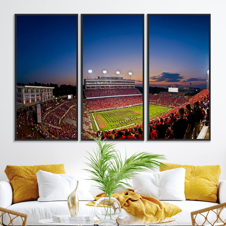 The Wolfpack Football Team Print captures a band and crowd at dusk in a premium canvas art style at Raleigh Carter-Finley Stadium.