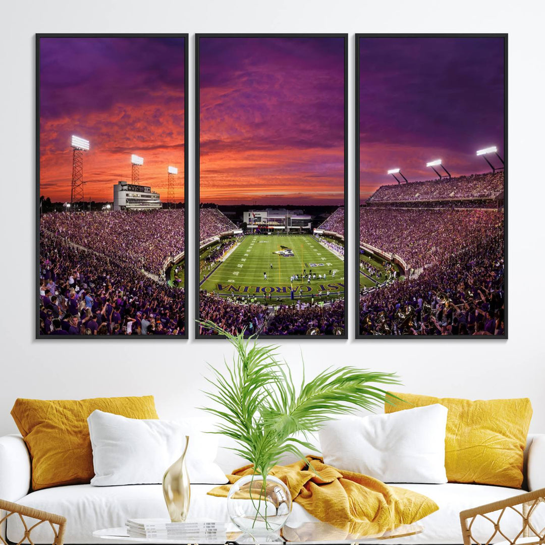 A sunset over Dowdy-Ficklen Stadium, Greenville, captured on museum quality canvas with vibrant purple and orange skies.