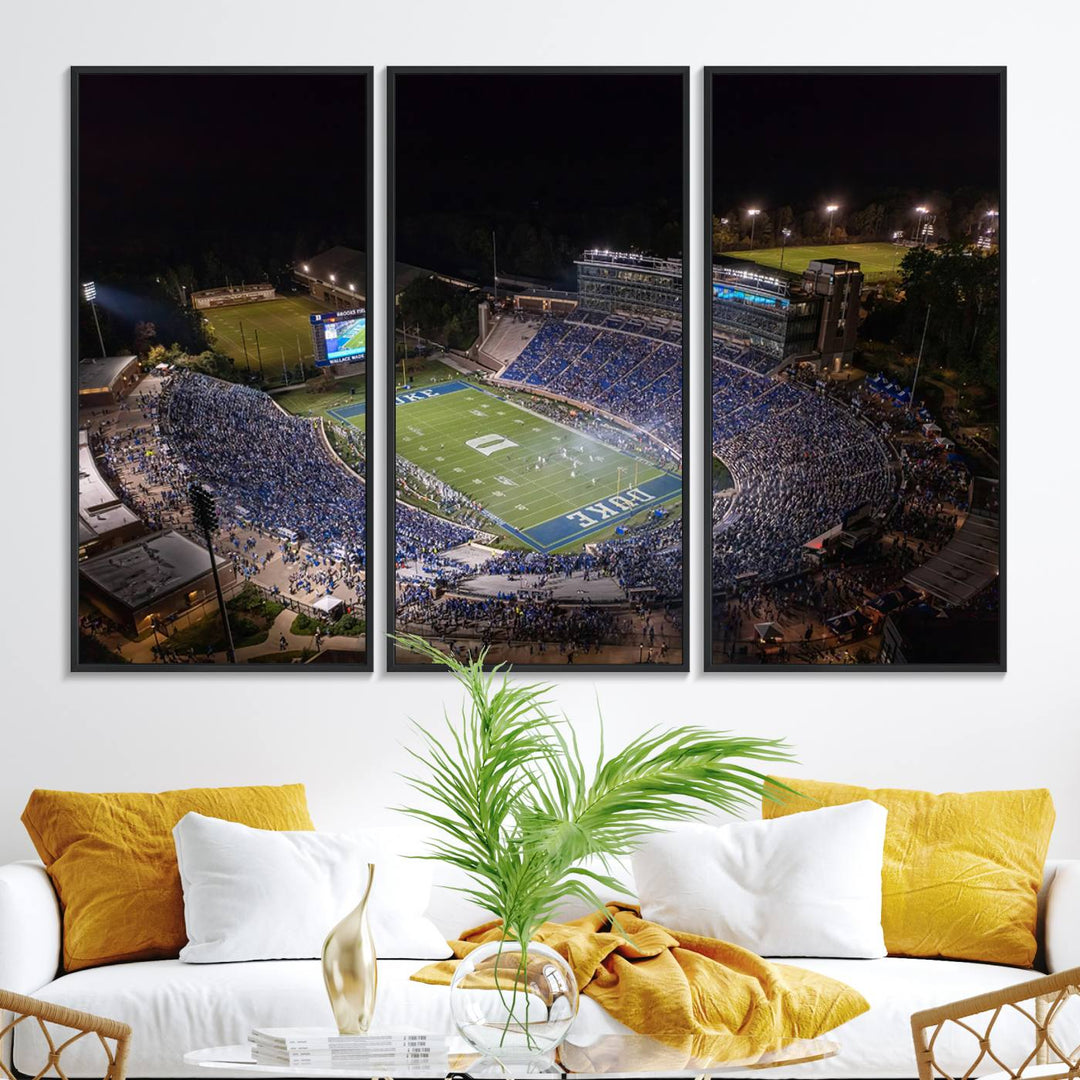 Night aerial view of packed Duke Blue Devils Wallace Wade Stadium, surrounded by trees and illuminated by lights; perfect for high-resolution prints.