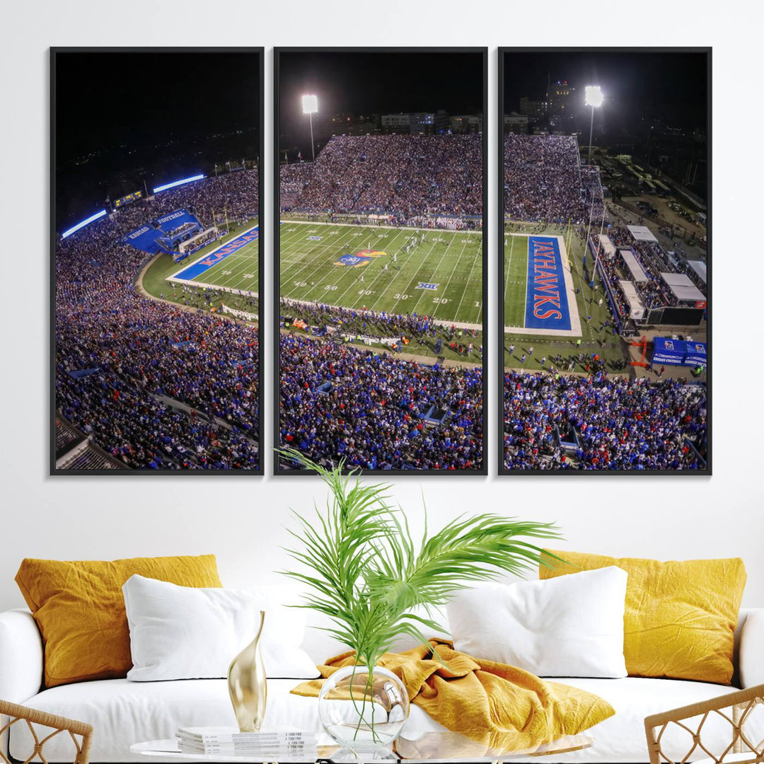 A canvas depicting an aerial view of the University of Kansas Memorial Stadium, showcasing bright lights and a lush green field at night.