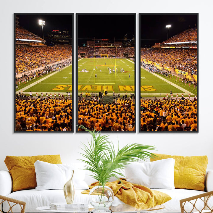 The Phoenix Stadium Canvas Wall Art features a vibrant depiction of a packed stadium filled with ASU Sun Devils fans wearing yellow shirts.