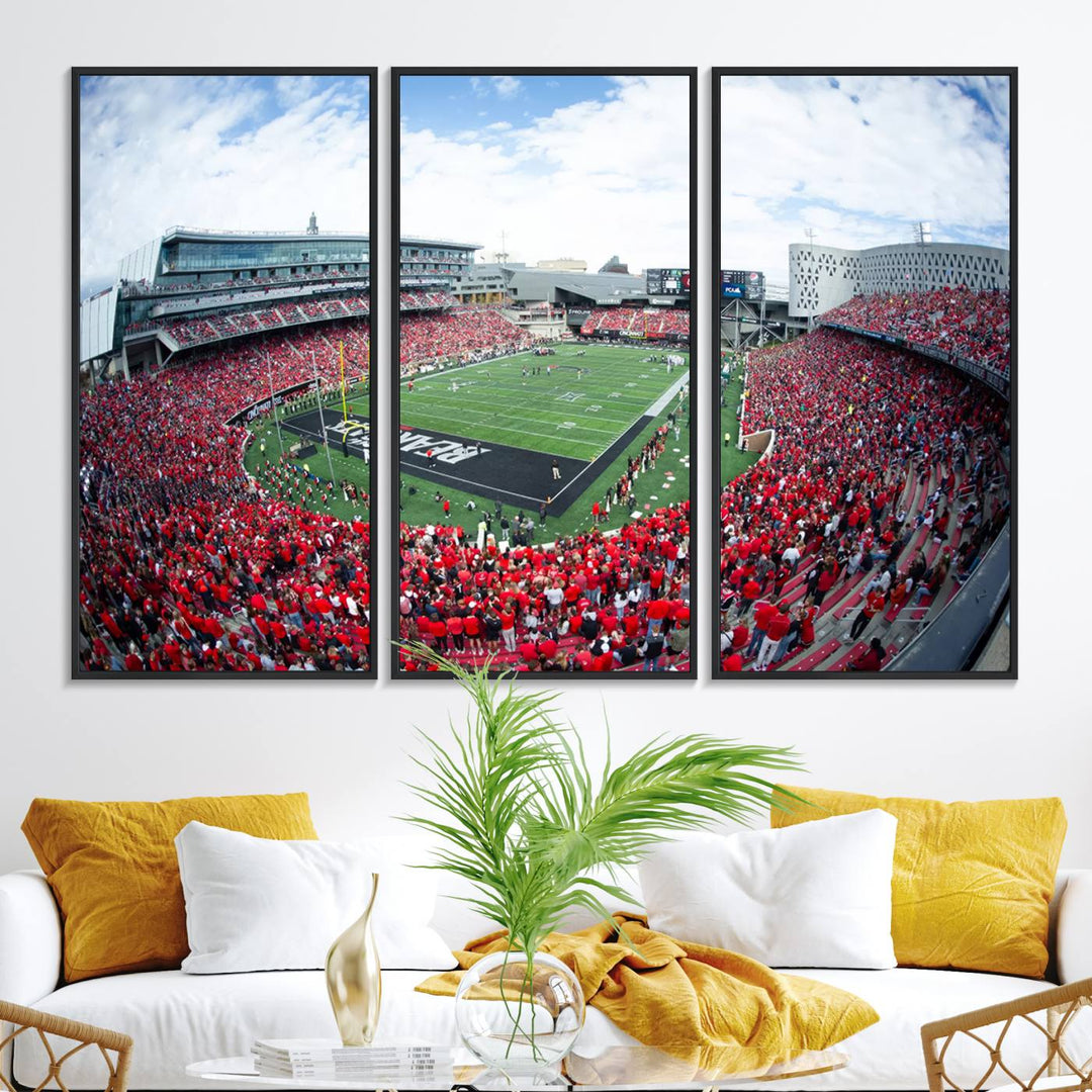 The wall showcases a Nippert Stadium canvas print of the Cincinnati Bearcats.