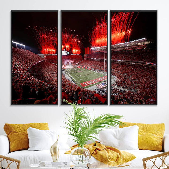 A vibrant red canvas art of a packed Ohio State Buckeyes stadium at night with fireworks.