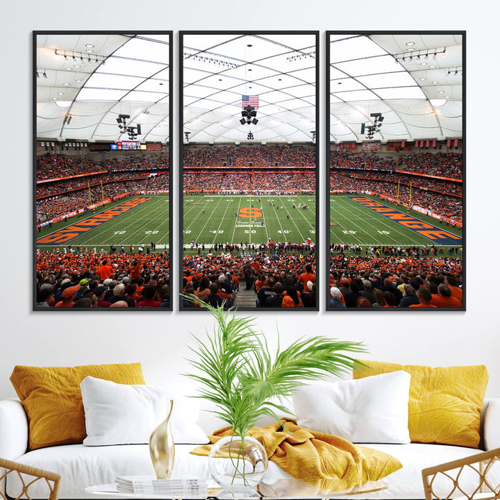 Fans fill the Syracuse JMA Wireless Dome, highlighted in orange and blue under a vaulted roof on this premium canvas print of the scene.