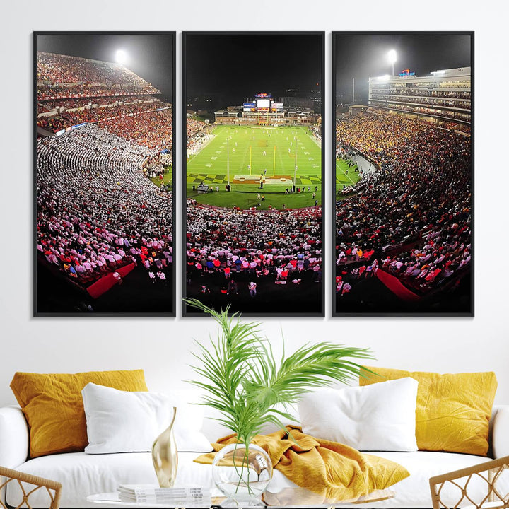 The Maryland Terrapins Football Wall Art Canvas showcases a packed SECU Stadium at night with a bright field and cheering fans.