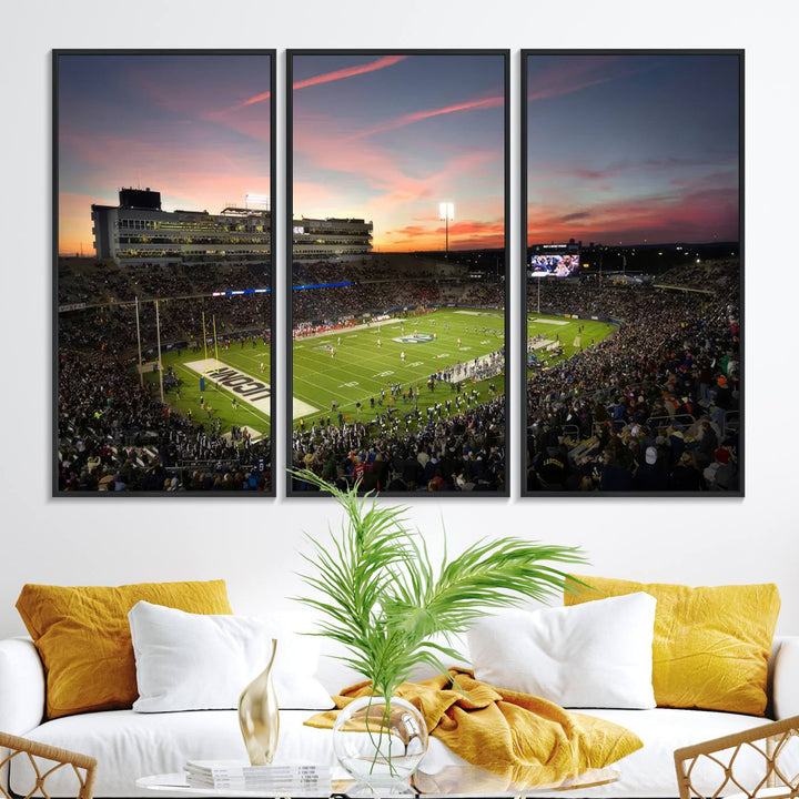 This wall art canvas print captures UCONN Huskies fans energizing a sunset scene at East Hartfords Pratt & Whitney Stadium.