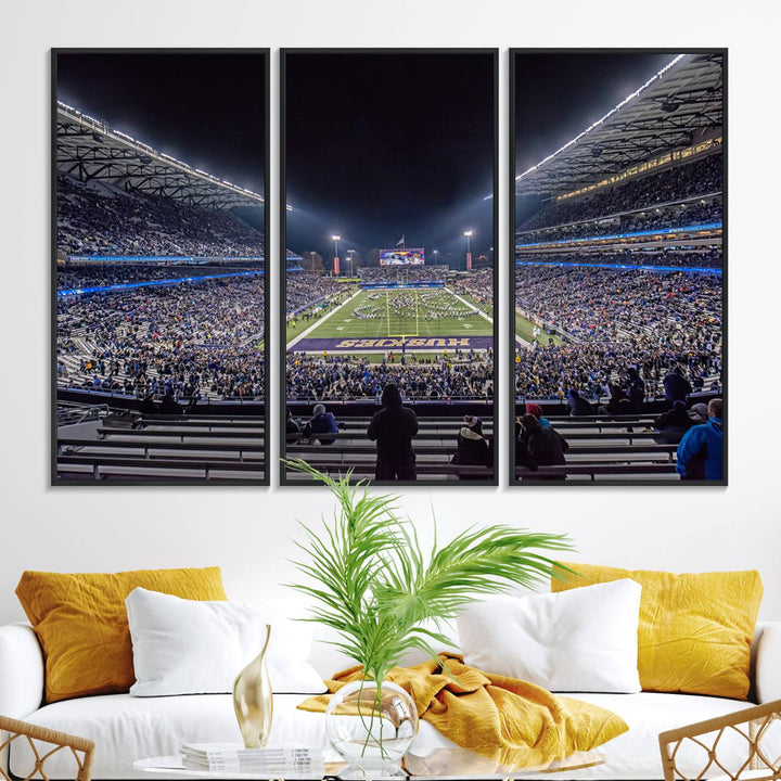 A canvas print titled The University of Washington Huskies Football depicts a packed Husky Stadium at night, as seen from the stands.