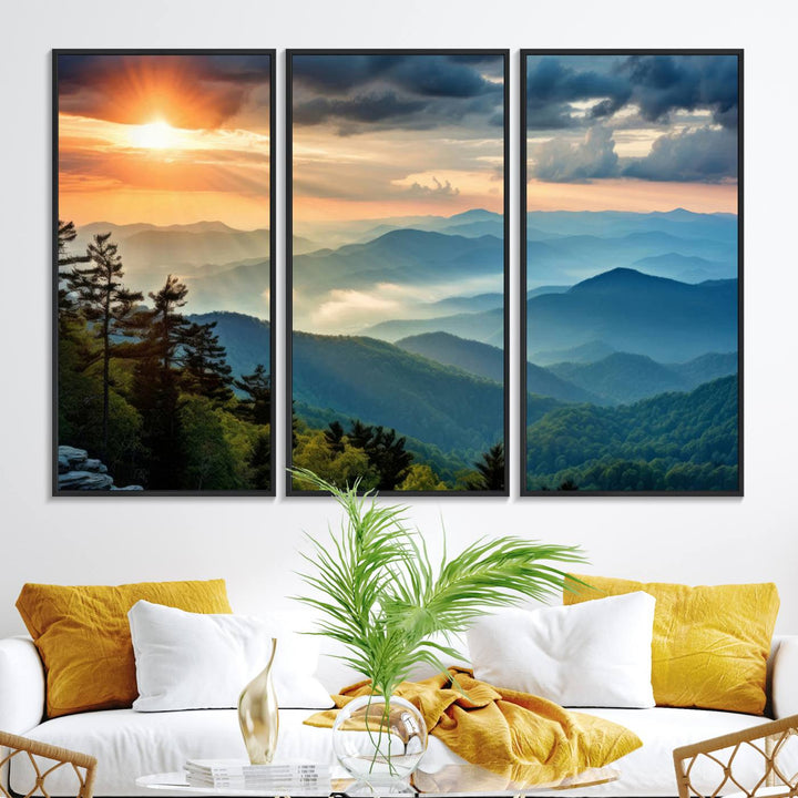 The wall art, titled Sunrise Over Mountain Range, is a canvas print that beautifully depicts layers of hills, scattered trees, and a partly cloudy sky.