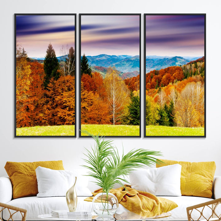 The wall art in the kitchen dining area is a large Autumn Forest Mountain Canvas Print that captures a vivid scenic landscape.