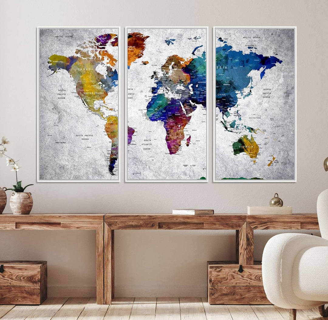 The World Map Art Canvas Print, featuring country names on a grunge-stained gray background, is perfect for stylish home decor.