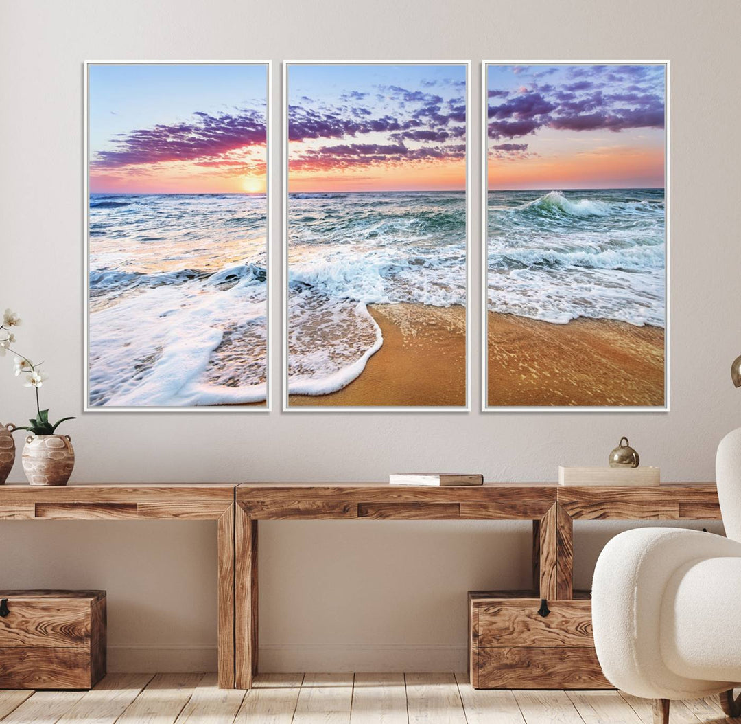 The Coastal Sunset Art Canvas Print features ocean waves beneath a vibrant sky in a stunning 3-panel seascape.