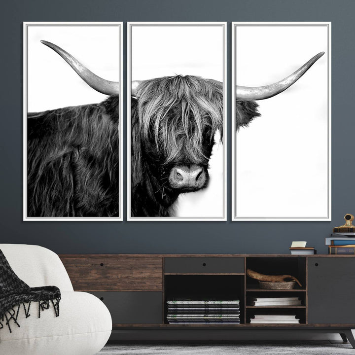 The Black and White Highland Cow Multi Panel Wall Art Canvas Print with UV-protection hangs prominently.