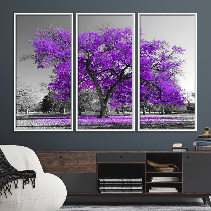 The Big Purple Tree Wall Art Canvas Print showcases a vibrant purple tree set against a black-and-white landscape.