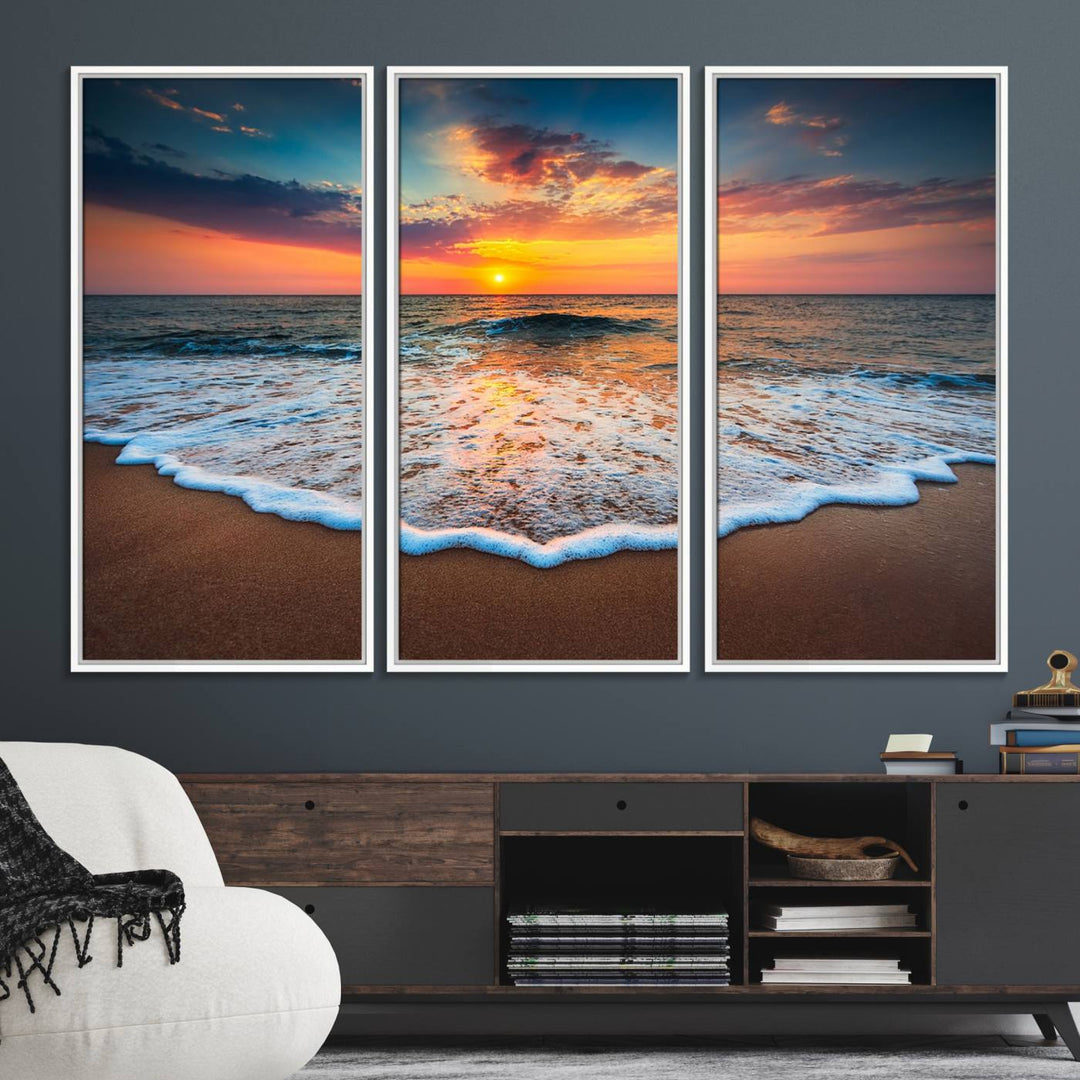 A Sunset with Calm Waves on the Beach Wall Art Canvas Print adorns the dining room.