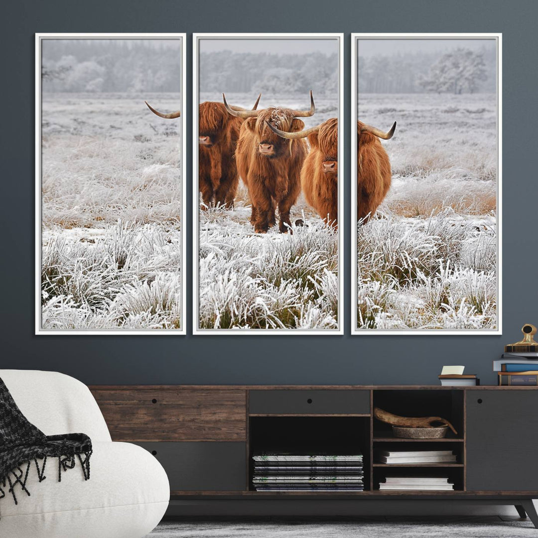 The Highland Cows in Snow canvas showcases three cattle in a frosty field.