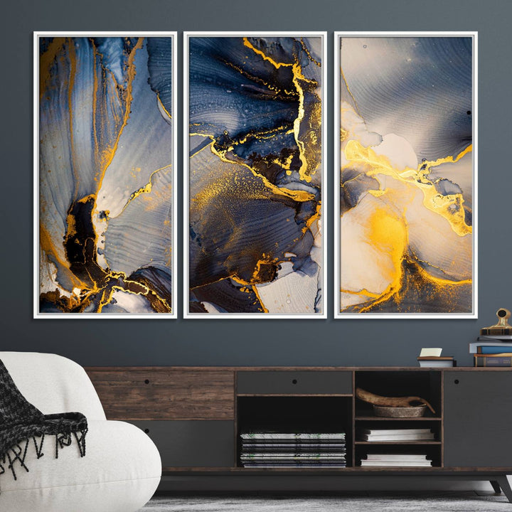 A modern luxury kitchen features a large gold and blue abstract canvas wall art print.