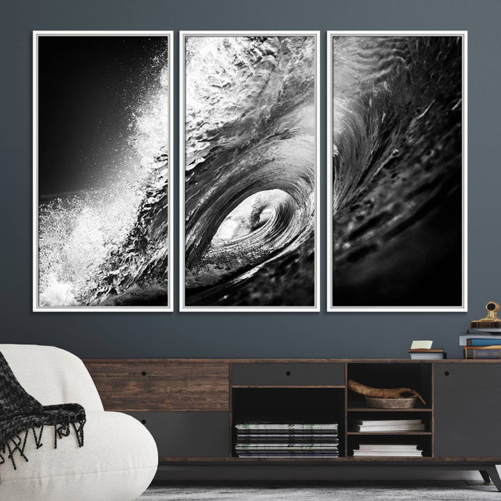 The Black Ocean Wave at Sunset Canvas Art hangs on a grey wooden wall.