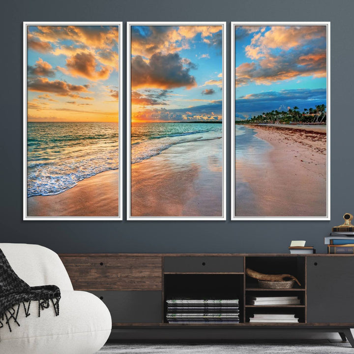 A wall displays Sunset Ocean Waves on Tropical Beach 3-panel canvas art.