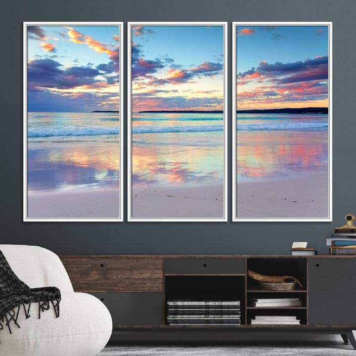 The Tranquil Pastel Sunset Beach Triptych Canvas Art hangs, showcasing its serene beauty.