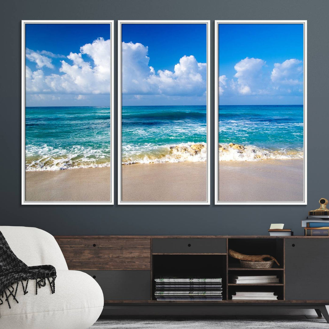 The Tropical Beach 3-Panel Canvas Wall Art features ocean waves gently lapping on a beach under blue skies, making it an ideal choice for coastal decor.