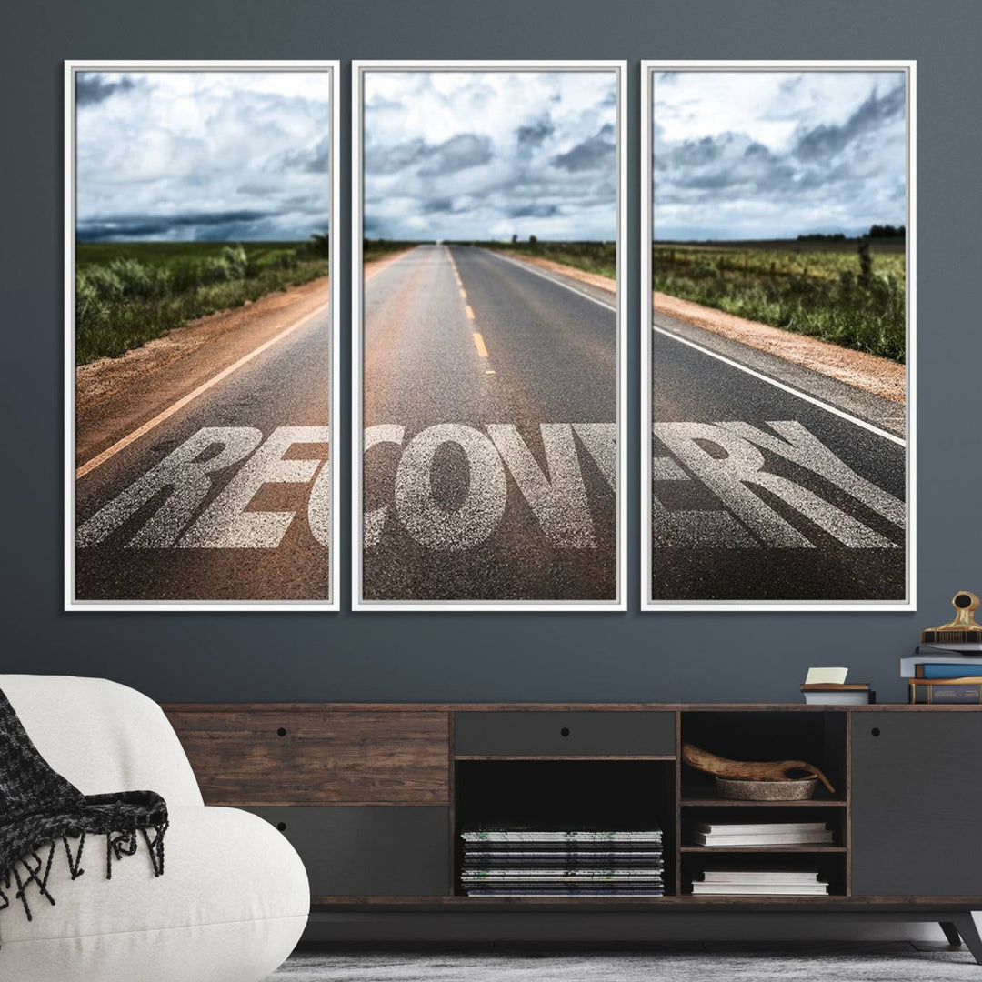 The Recovery Road Wall Art Canvas Print depicts a road under a cloudy horizon.