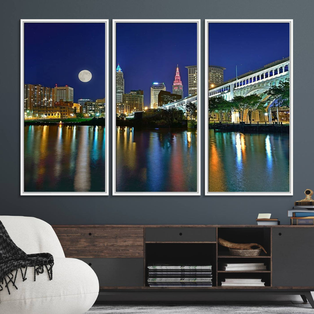 Cleveland City Lights Night Skyline Wall Art canvas showcases a moonlit cityscape reflected on water.