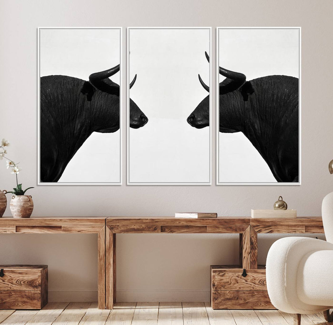 Spanish Bull Wall Art Canvas Print: Two black bull heads facing off on museum-quality canvas.