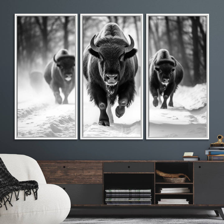 The Buffalo Wall Art Canvas Print of bison running through snow adorns the wall.