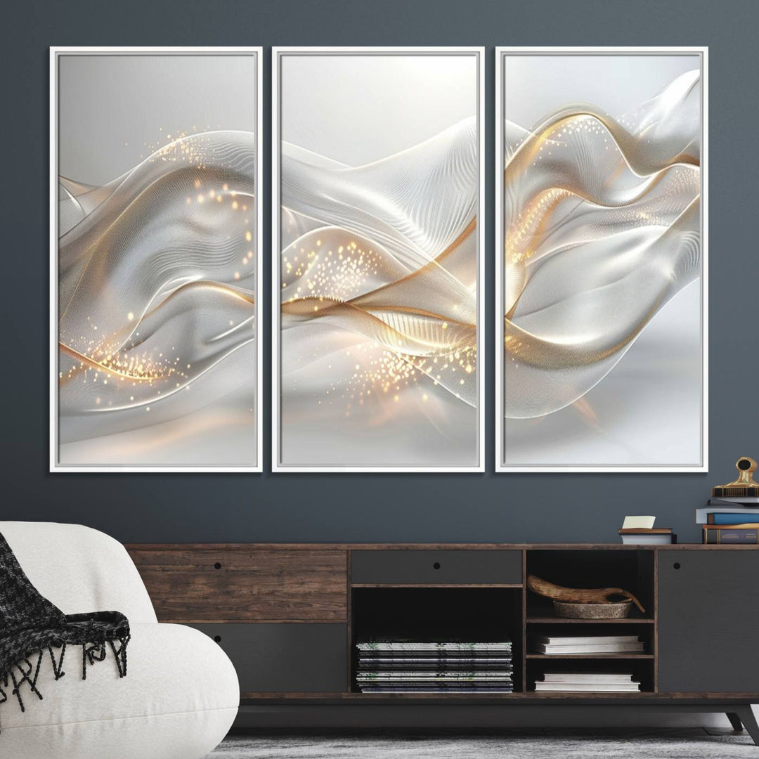 A modern living room is enhanced by the Abstract Art Grey and Gold Lines Wall Art, its elegant lines shimmering against a dark wall.