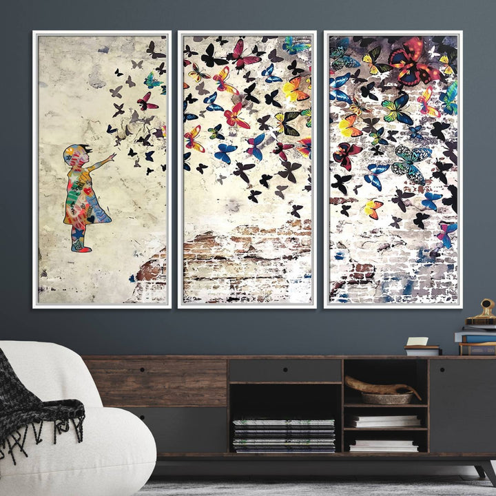 A Banksy Girl Butterfly Canvas Print is displayed on the textured wall.