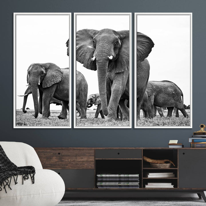 A modern dining area features a Black White Elephant Family Wall Art Canvas Print.