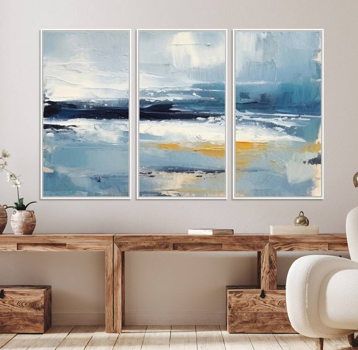 The Abstract Ocean Canvas Wall Art in coastal blue and gold enhances the modern kitchen.