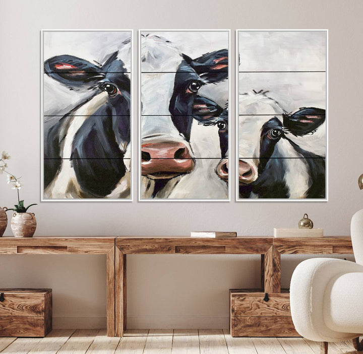 The Vintage Baby and Mom Cattle Canvas, featuring cows with black and white patches, is a prominent piece of wall art.