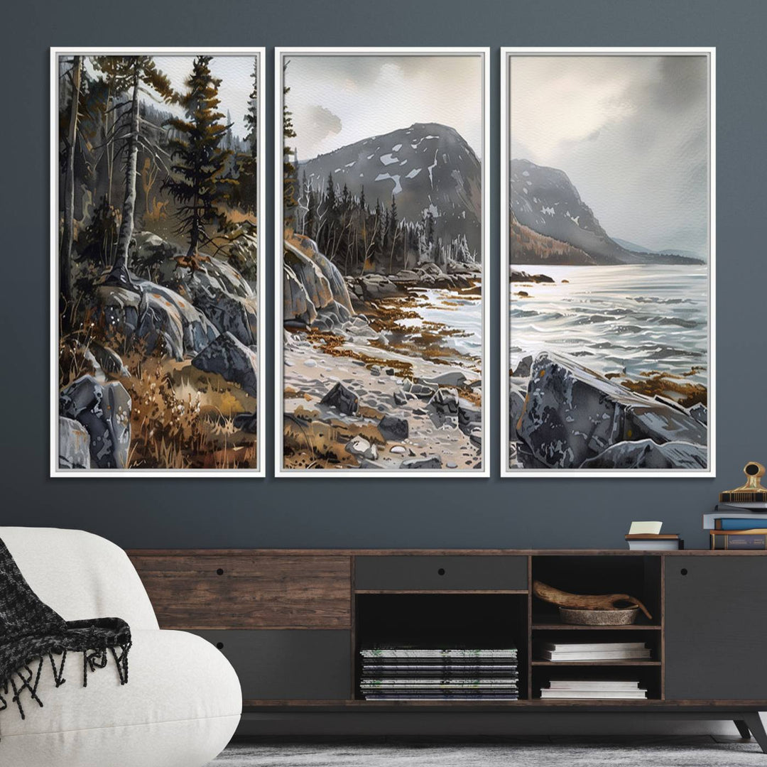 Framed wall art depicting Acadia National Parks rocky coast, trees, mountains, and sunlight over the sea; ready to hang.