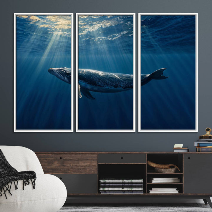 The Whale under Ocean wall art canvas print graces the white wall.