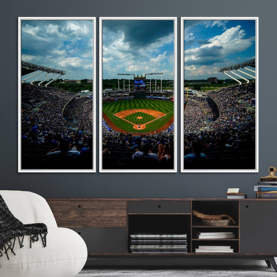 A 3-panel print of Kauffman Stadium, showcasing a crowded baseball field under cloudy skies.