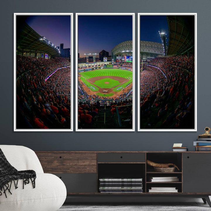 A canvas print of Houston Minute Maid Park at dusk is mounted on the wall.