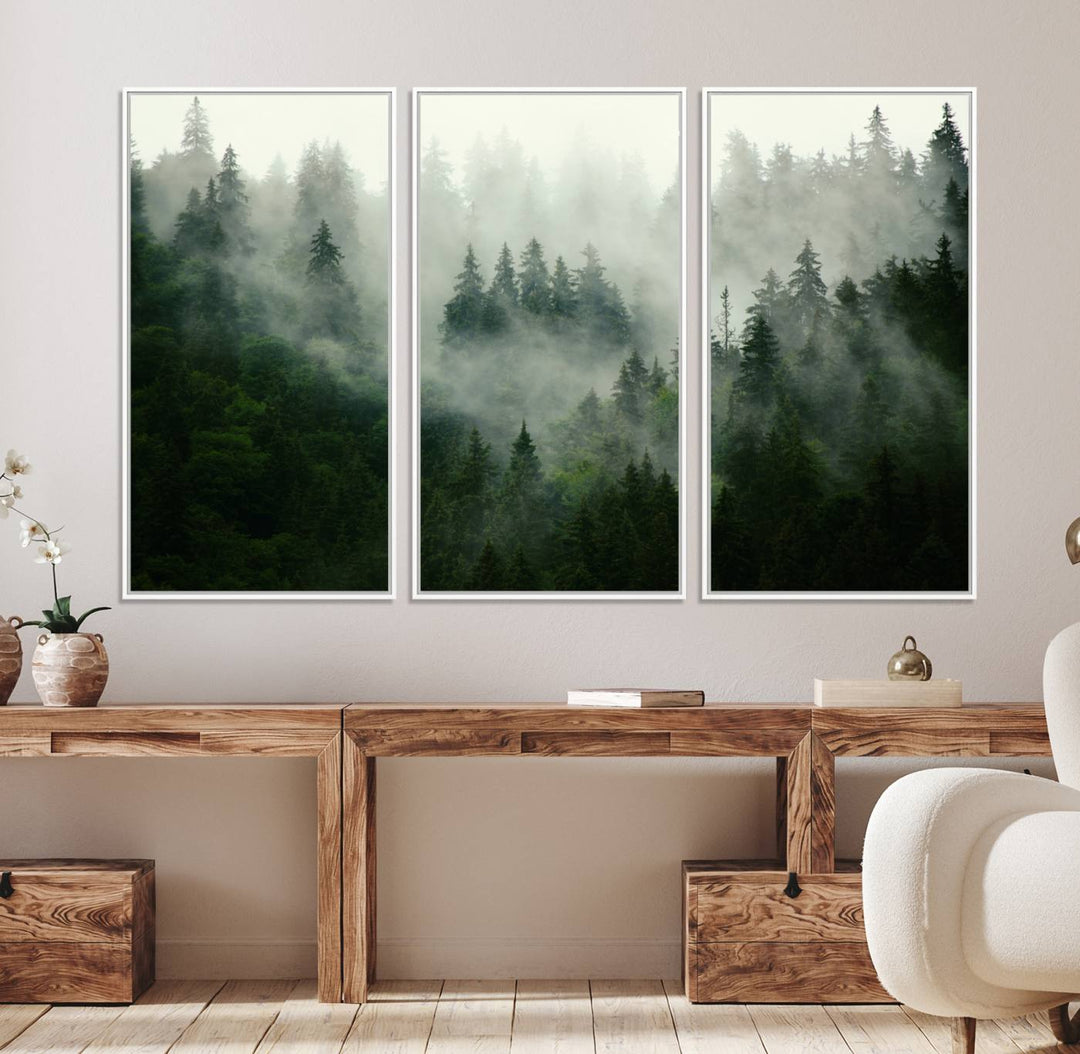 The Misty Forest Wall Art Canvas Print captures a serene, foggy evergreen landscape, evoking a mysterious woodland ambiance.