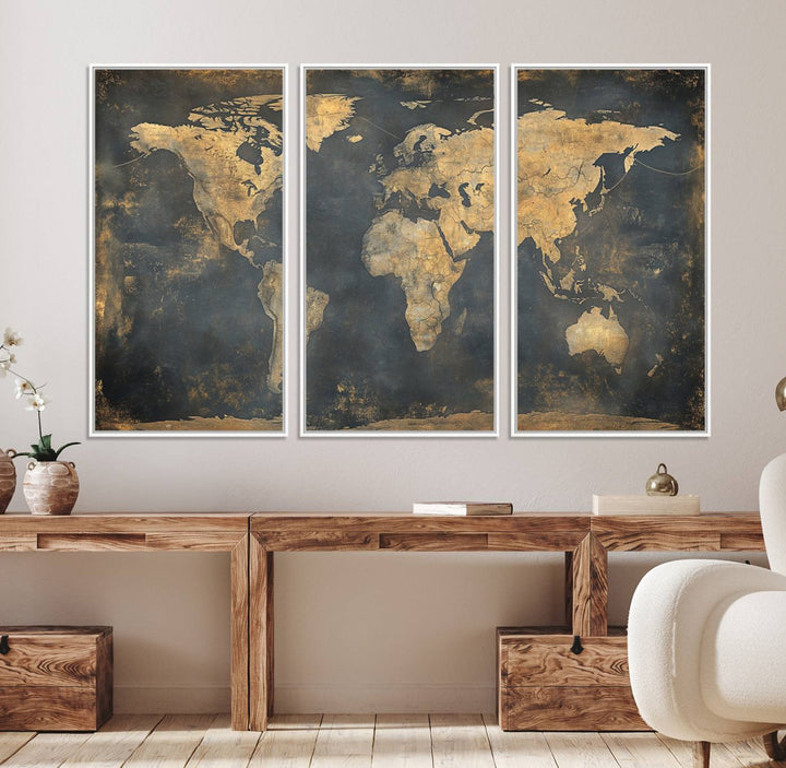 The Grunge World Map Canvas Wall Art features golden tones and is displayed against a white-paneled wall.