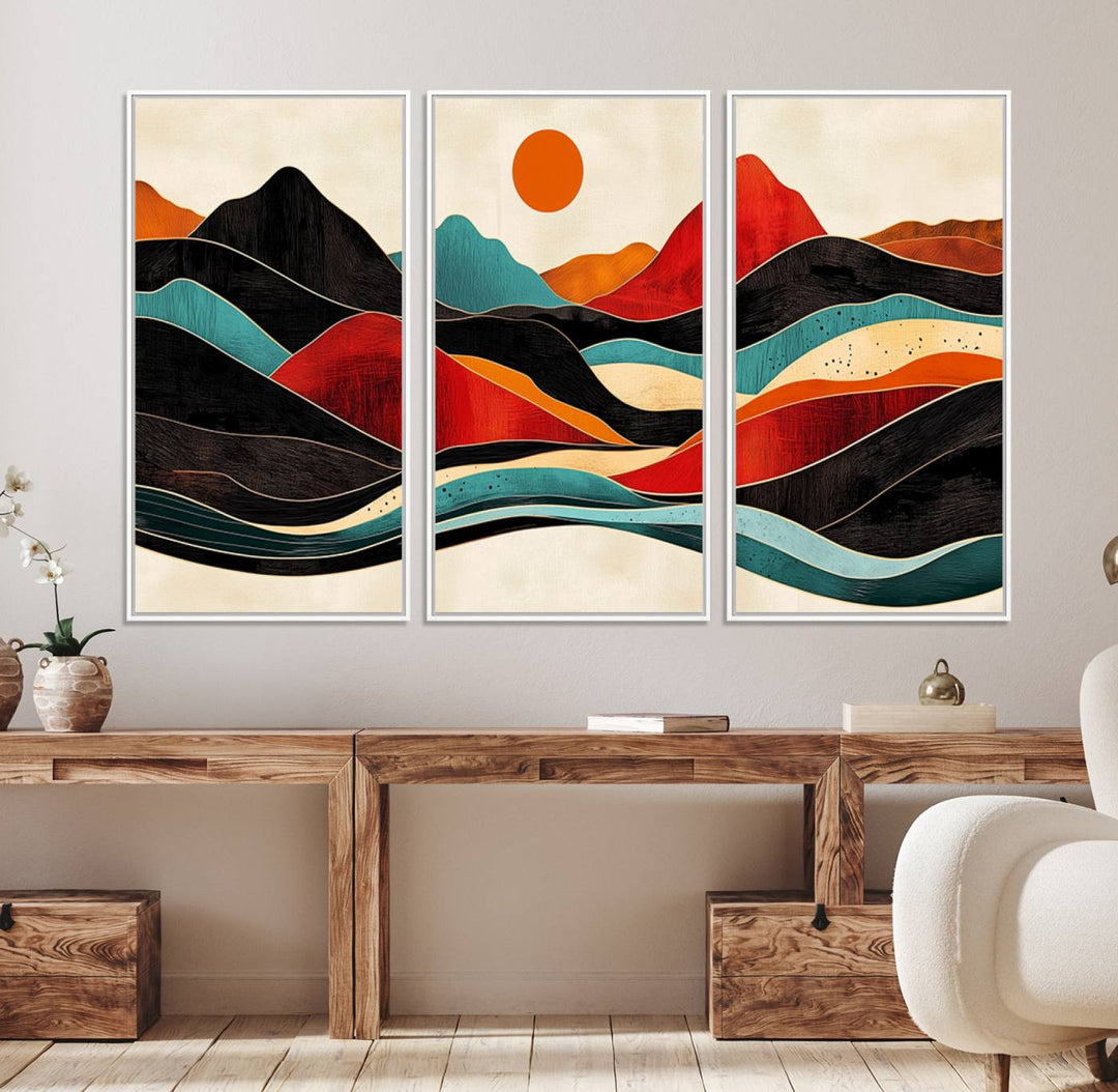 The Colorful Western Triptych Canvas features a vibrant mountain and sun design, making it perfect for modern kitchens or log cabin walls.