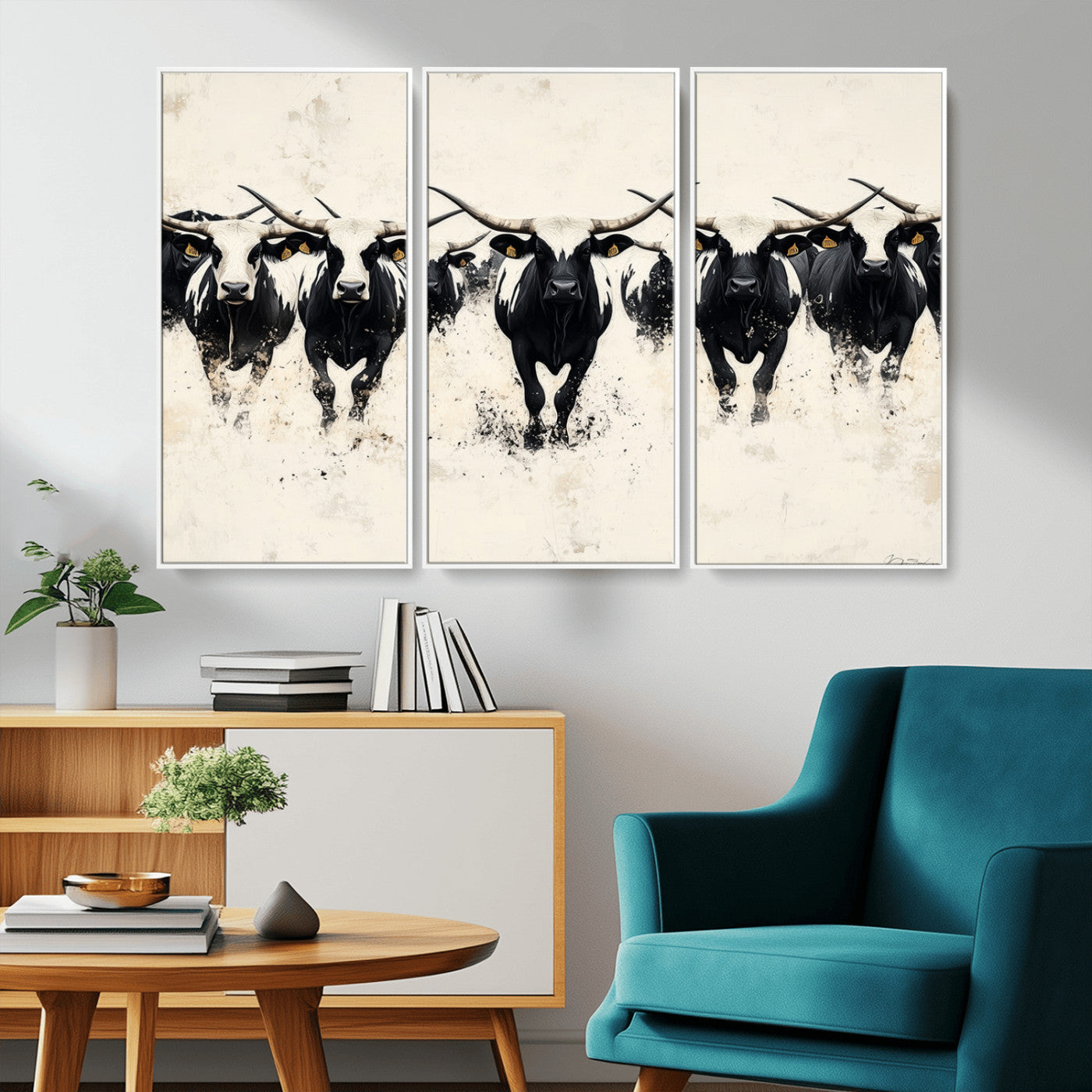 Canvas artwork of black and white Texas longhorns in a bold stampede over a minimalist background, ideal for rustic modern or Western-themed decor.