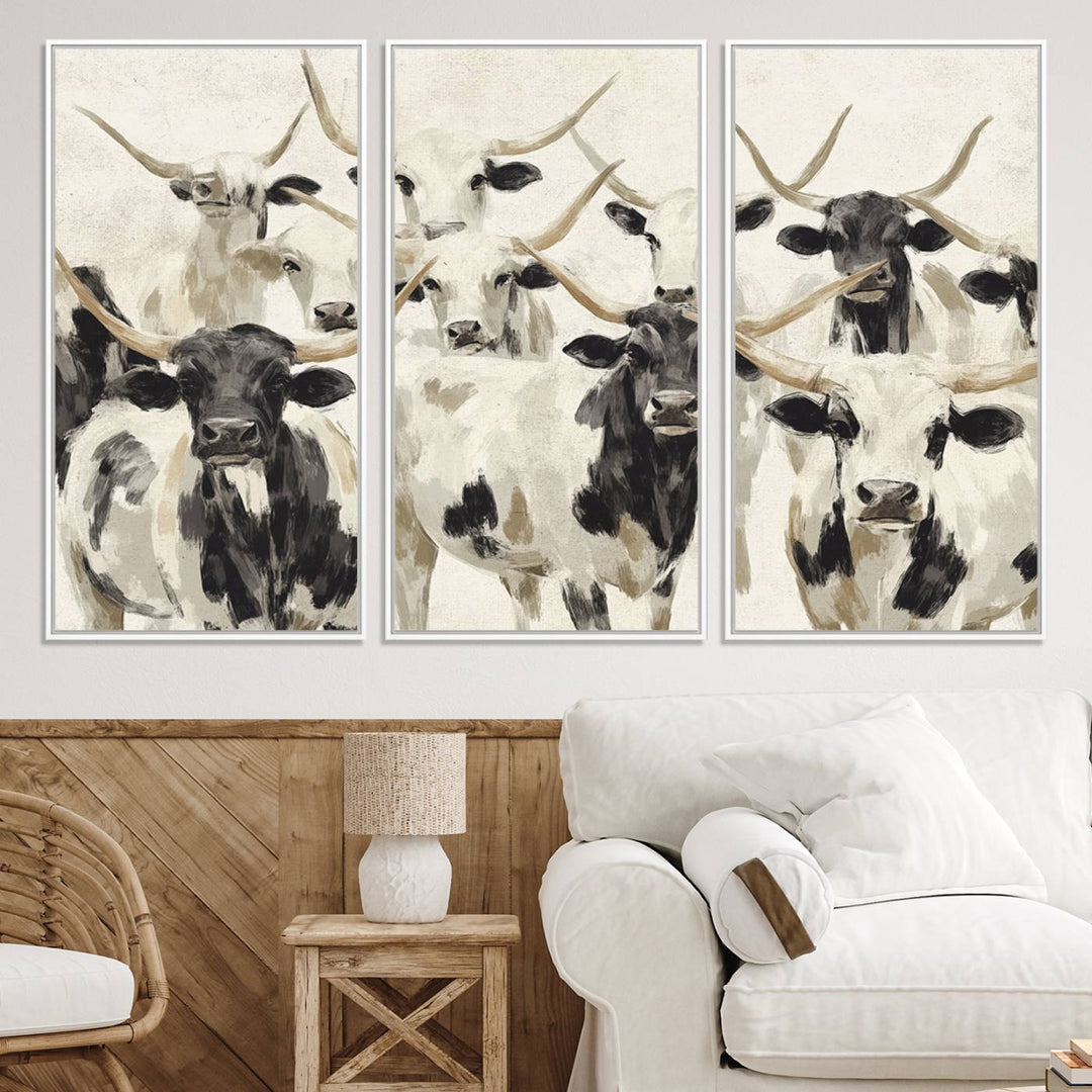 Canvas print titled Longhorn Texas Cow Drawing, depicting longhorn cattle with black and white markings, made in the USA, displayed on the wall.