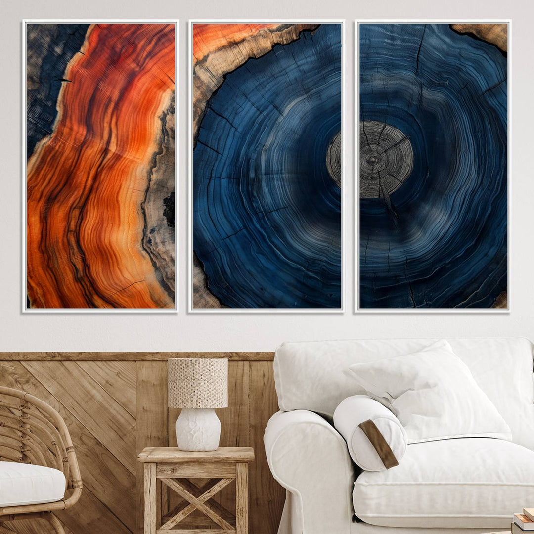 Abstract Tree Ring Wall Art Print on canvas featuring vibrant blue, orange, and brown rings with a natural rustic wood texture. Free shipping available!.