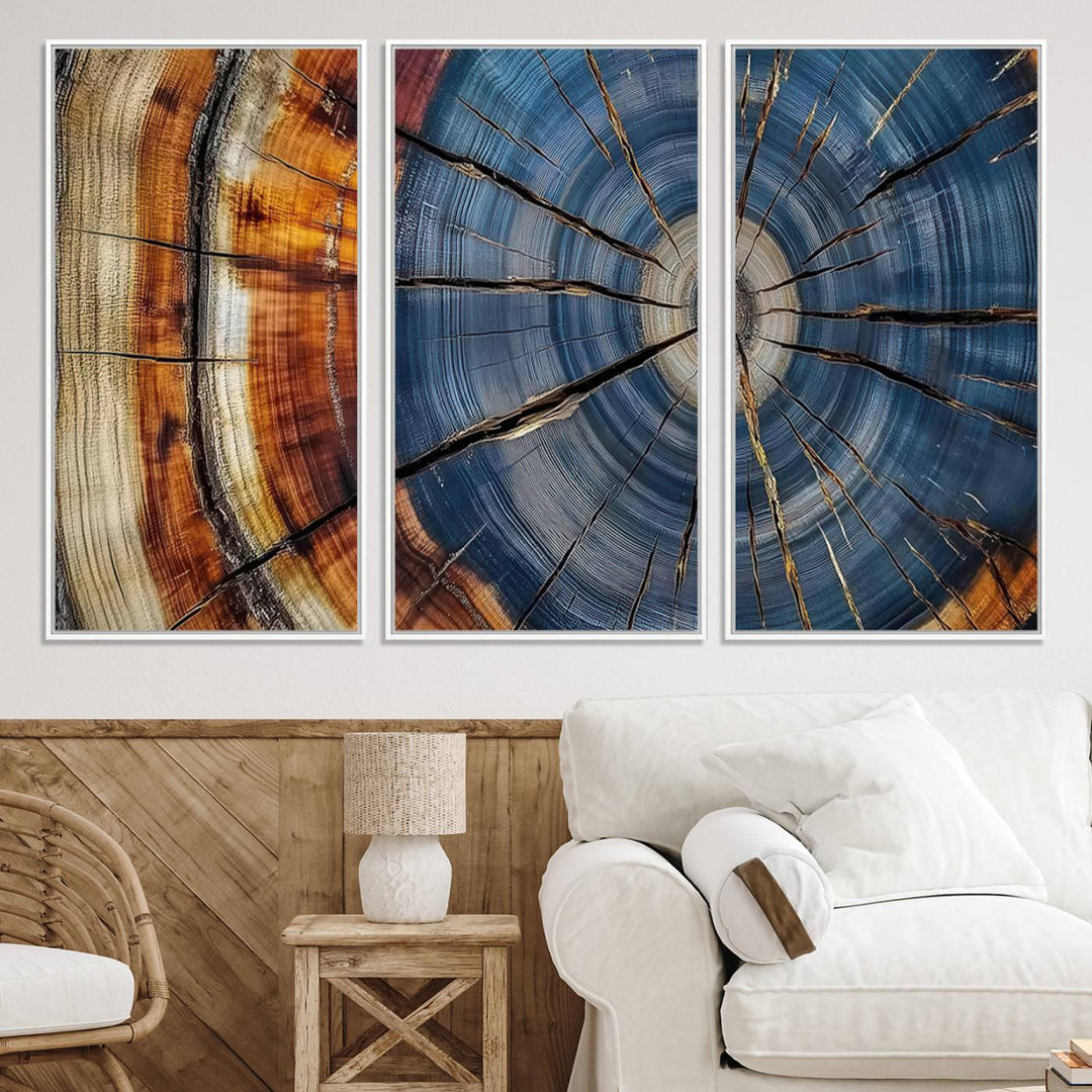 Close-up of blue, brown, and orange wood grain rings on the Abstract Tree Rings Canvas Wall Art Print.