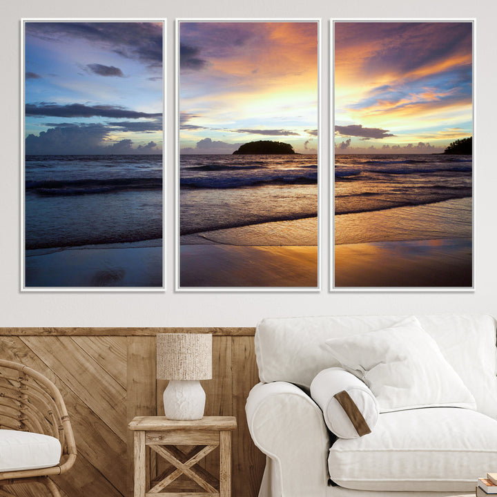 A tropical beach at sunset with waves gently washing ashore, reflecting golden and purple hues in the sky, creating a tranquil coastal scene.
